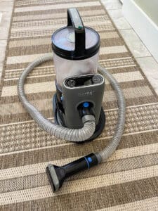 The FurMe Vacuum grooming tool.
